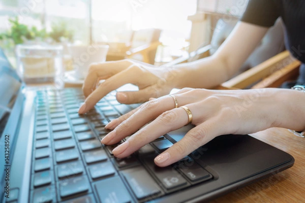 Fototapeta Hand on keyboard close up, business woman working on laptop in home office as agile technology concept