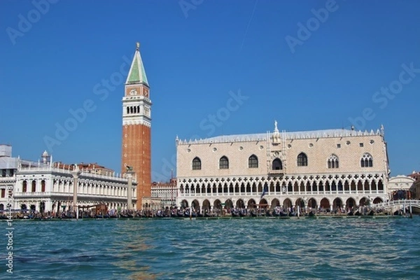 Fototapeta Panoramic view of Saint Mark's square in Venice: The bell tower or Campanile of the Basilica Saint Mark and the Doge's palace. Italy, Europe.