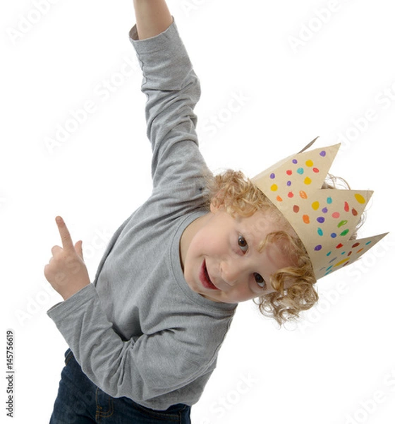 Fototapeta blond little boy with a crown on his head, on white