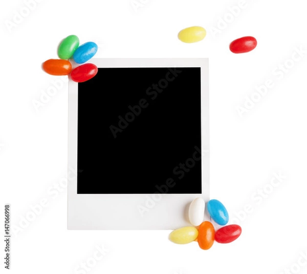 Fototapeta Photo frame with candy isolated on white background