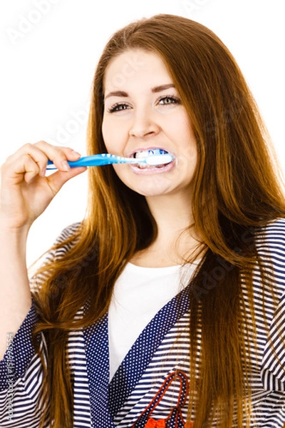 Fototapeta Woman brushing cleaning teeth.