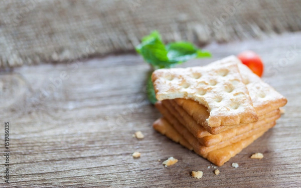 Fototapeta Crackers or biscuit on wooden background