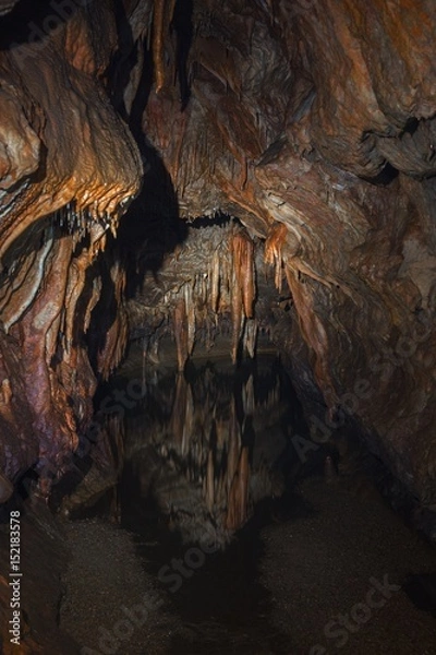 Fototapeta Underground lake sorrunded by rocks