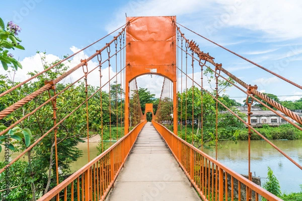 Fototapeta Orange bridge cross the river at Jung cave in Vang Vieng,