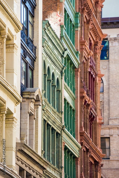 Fototapeta Brick and stone facades frontage in different colors