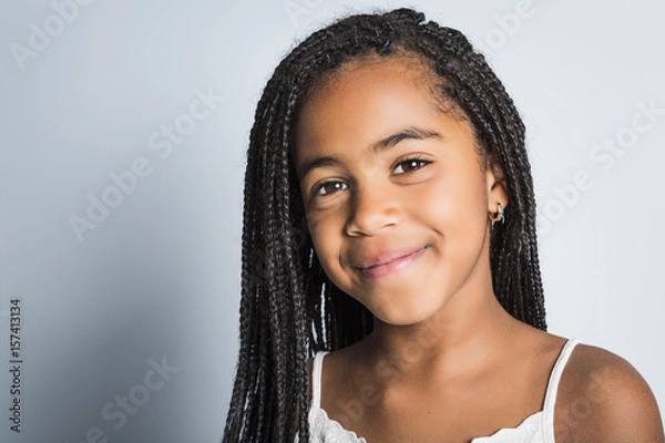 Fototapeta Adorable african little girl on studio gray background