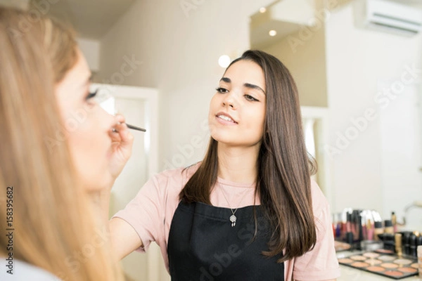 Fototapeta Make-up artist in a beauty salon