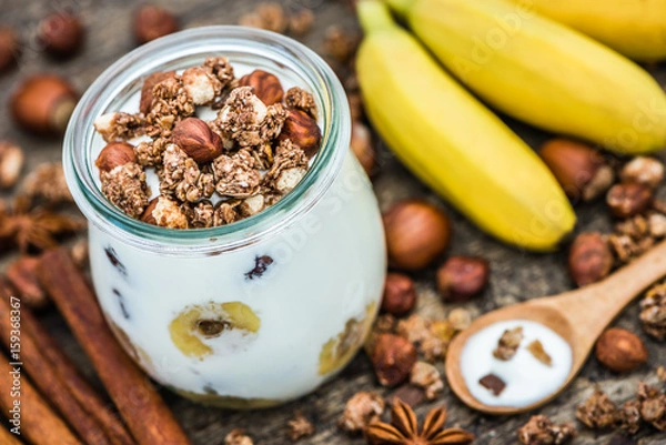 Fototapeta Serving of Yogurt with  Muesli, Banana and Nuts