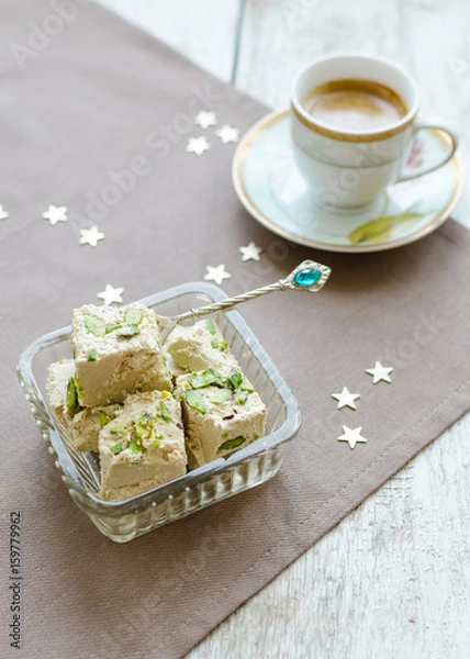 Fototapeta Halva pistachio and cup of coffee