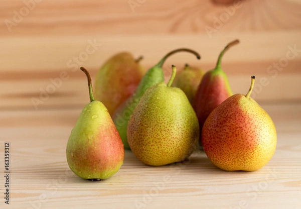 Fototapeta Fresh pears on the wooden table.