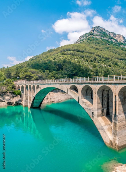 Fototapeta Bridge over the Ulldecona reservoir dam in Castellon of Spain