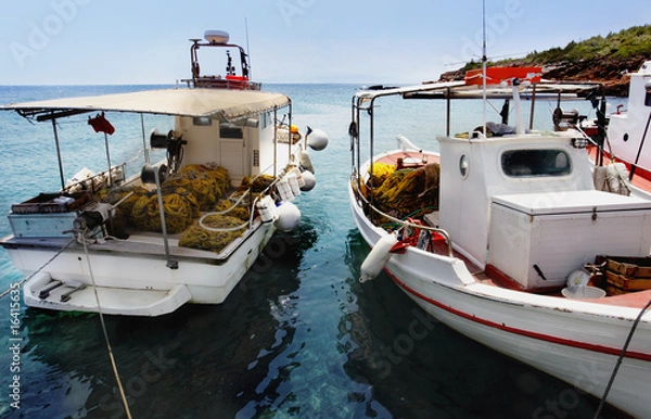 Fototapeta Fishing boats docked at a harbor