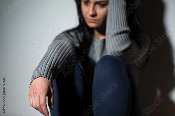 Fototapeta sad crying woman suffering from domestic violence