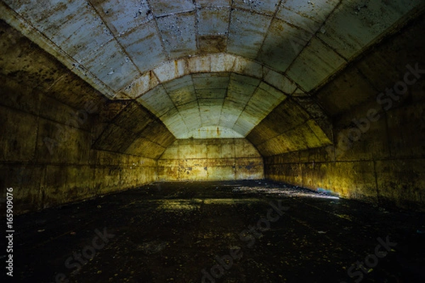 Fototapeta Inside big rusty underground abandoned fuel tank for refueling diesel submarines at repair factory 