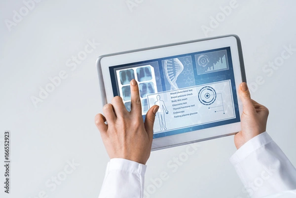 Fototapeta Close of female doctor hands working with tablet pc computer