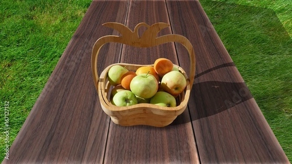 Fototapeta Organic apples in basket in summer grass. Fresh apples in nature