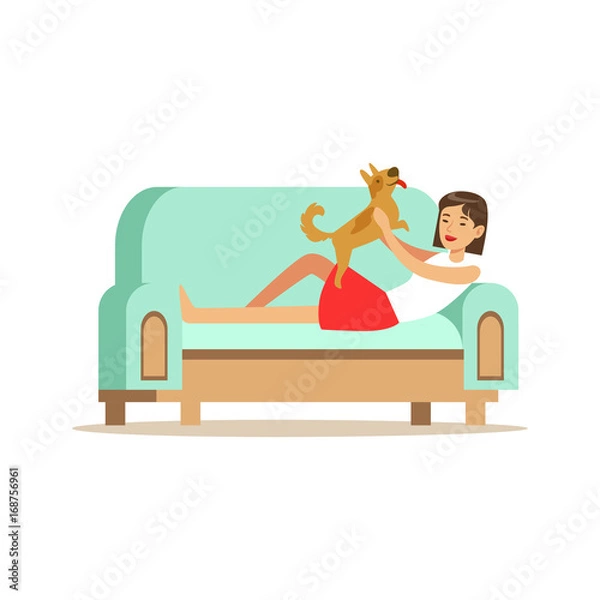 Fototapeta Young woman lying on a light blue sofa and playing with her puppy, woman resting at home vector Illustration