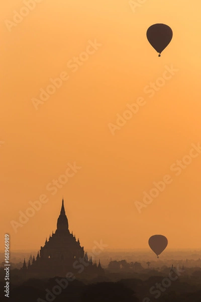 Fototapeta Beautiful sunrise in Bagan Archaeological Zone & Hot air balloons fly over the Buddhist temples at sunrise in Bagan, Myanmar. This temple town is one of Myanmar main attractions.