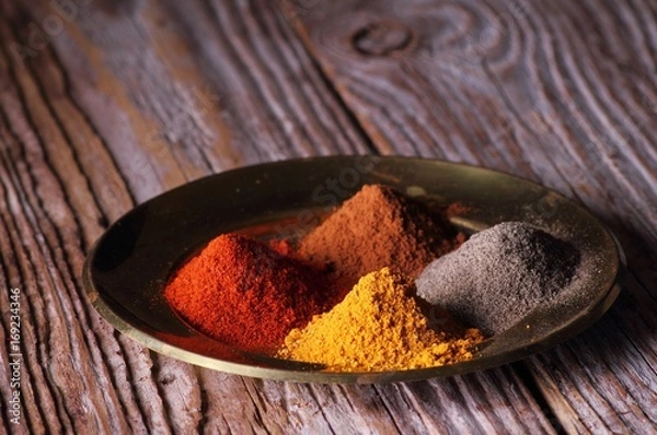 Fototapeta Plate with aromatic powder spices