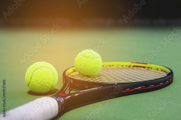 Fototapeta Tennis racket with balls on court