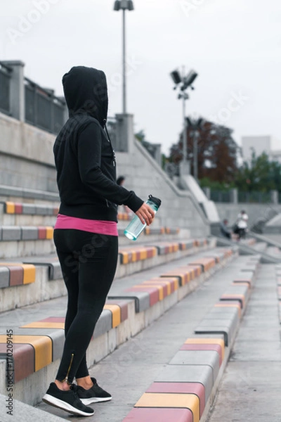 Fototapeta fitness girl with water bottle in hand