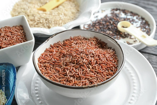 Fototapeta Bowl with jasmine brown rice on plate