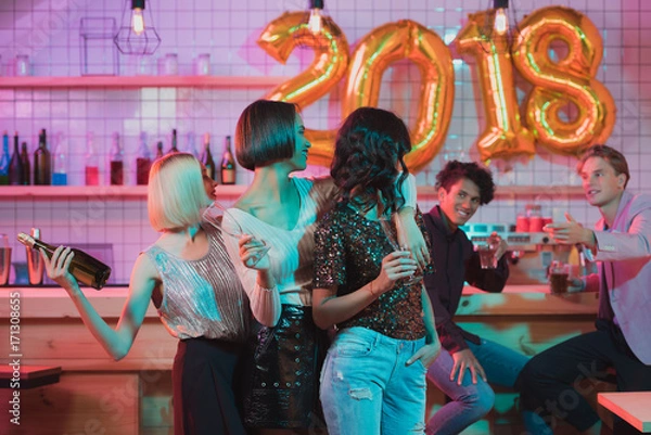 Fototapeta multiethnic women celebrating new year