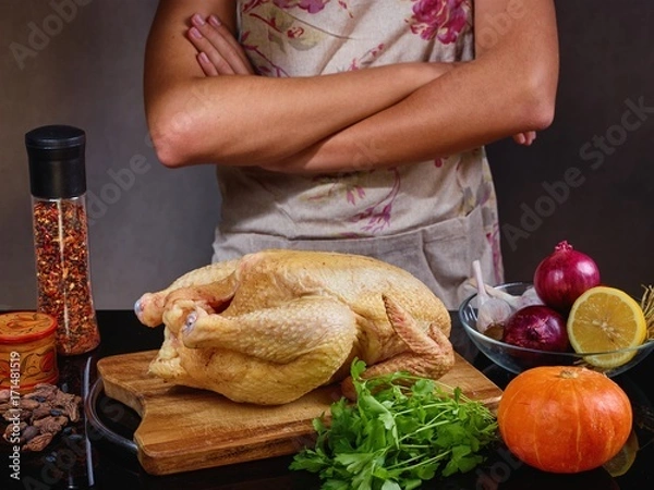 Fototapeta food photo cook in apron prepares chicken