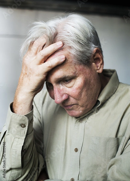 Fototapeta Elderly caucasian man with worried thoughtful expression