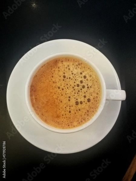 Fototapeta a cup of tea viewed from above