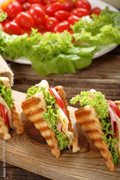 Fototapeta Fresh sandwiches on wooden background