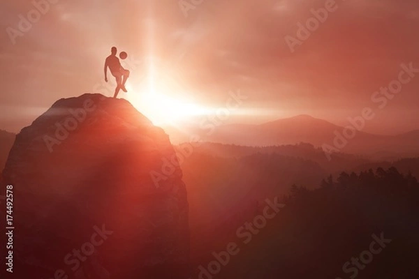 Fototapeta Composite image of silhouette of a soccer player 