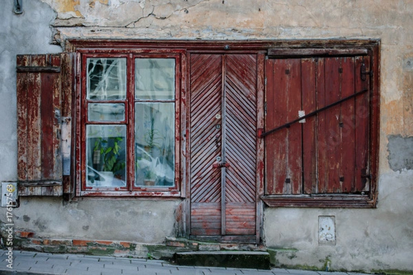 Fototapeta Old and rough booden door and windods in Vilnius old town