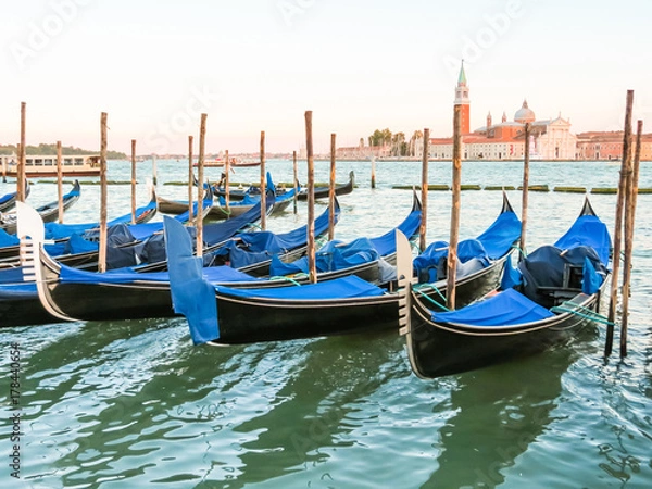 Fototapeta Gondolas moored in the Venetian lagoon