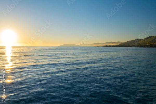 Fototapeta Waiting for the Sun to set at Pismo Beach, Oceano Dunes Natural Preserve, California, USA