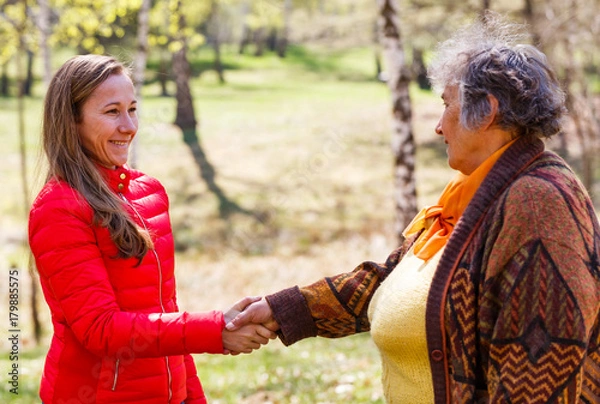 Fototapeta Elderly woman and young caregiver