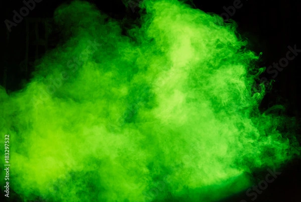 Fototapeta Green theatrical smoke on stage during a performance or show.