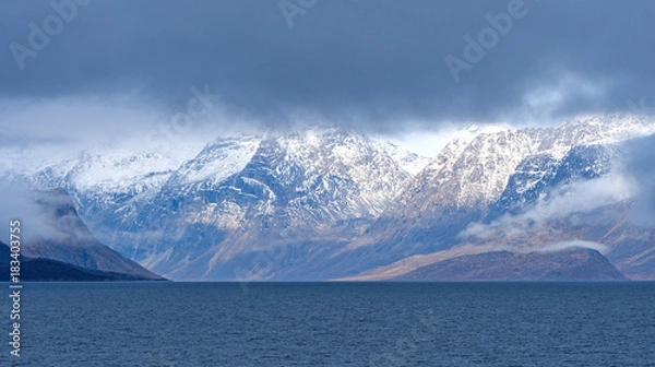 Fototapeta Dramatic Mountains Breaking Through the Coastal Clouds