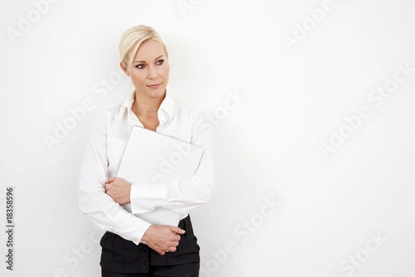 Fototapeta Blond businesswoman on white with laptop