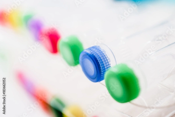 Fototapeta Chemical tubes with colorful caps. Medical laboratory research. drug discovery, pharmacology and biotechnology concept. science and research background with copy space.