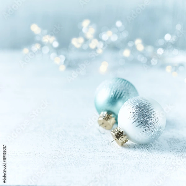 Fototapeta Silver and Blue Christmas Balls on white wooden background