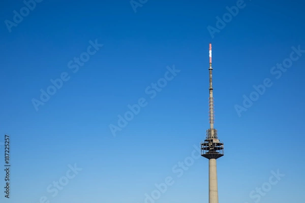 Fototapeta radio and television transmitter, A tower signal with blue sky background. Nice weather and beautiful day