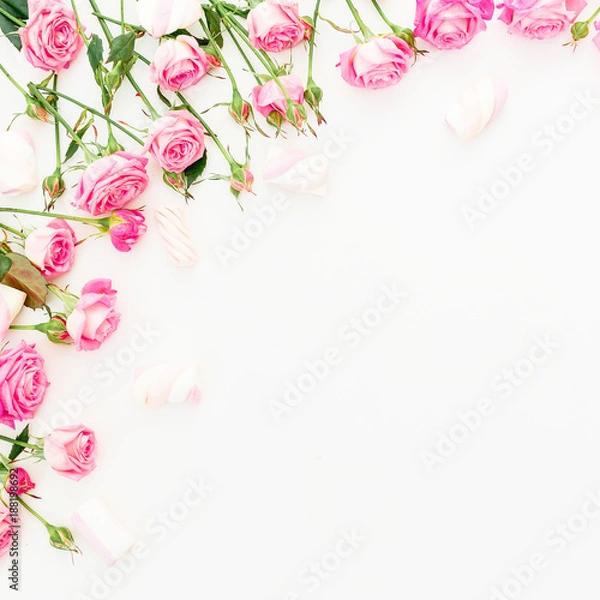 Fototapeta Flower frame of pink roses and marshmallow on white background. Flat lay, Top view.