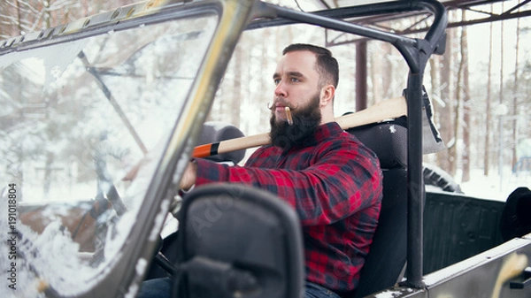 Fototapeta Bearded man in car