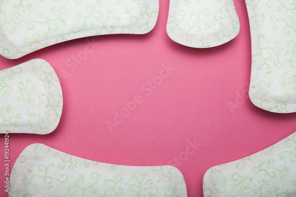 Fototapeta Menstrual pad isolated on pink background, copy space.