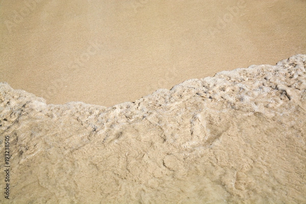 Fototapeta background of wet sand on the coast of the Andaman sea.Phuket,Thailand