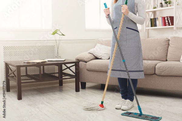 Fototapeta Unrecognizable woman cleaning house with mops