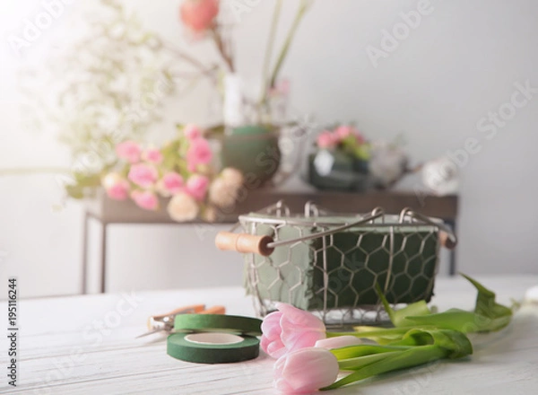 Fototapeta Florist equipment with flowers on table