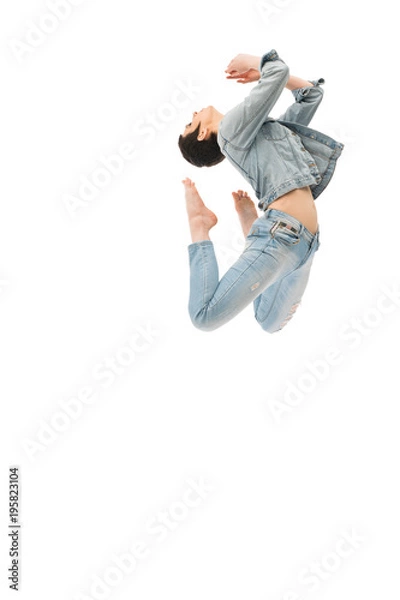 Fototapeta Brunette with shot haircut jumping gracefully