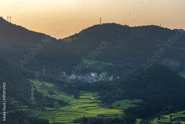 Fototapeta Morning Sky and Light at Snail Farms, Luositian Viewpoint in Niujie near Louping, South of China.